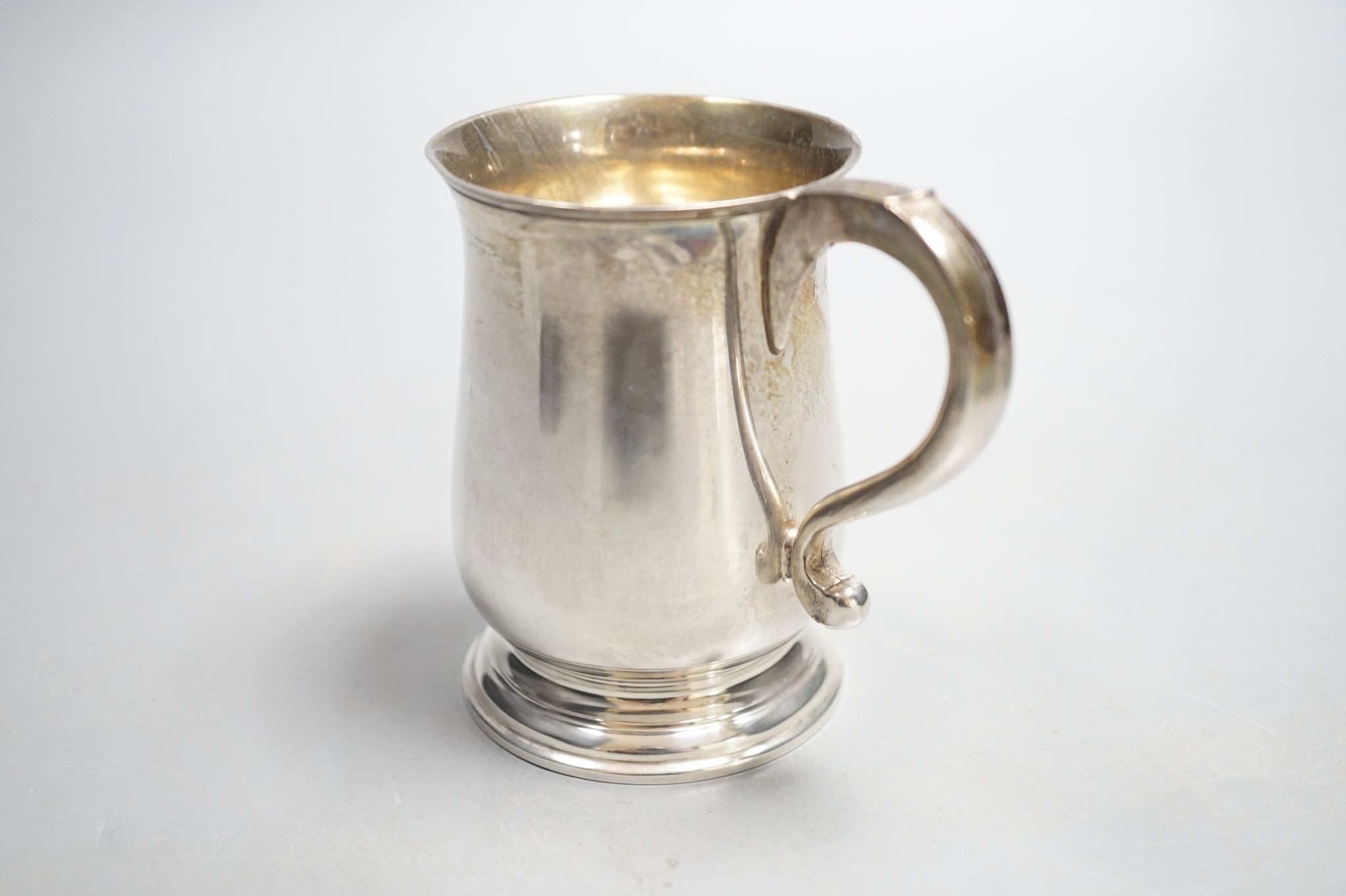 A Victorian silver christening mug, London, 1936, with engraved inscription, 89mm, 141 grams.